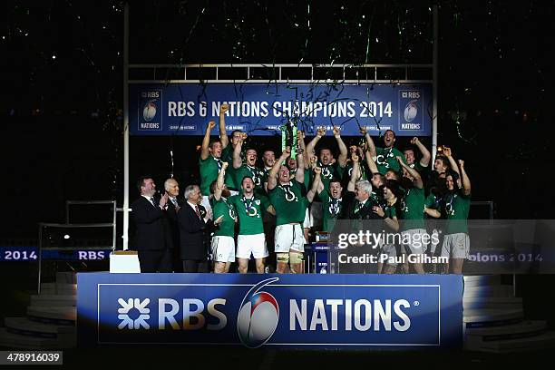 Brian O'Driscoll and captain Paul O'Connell of Ireland celebrate with their team-mates as they lift the trophy after winning the six nations...