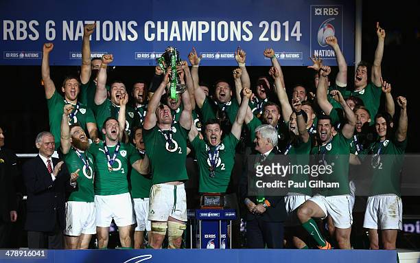 Brian O'Driscoll and captain Paul O'Connell of Ireland celebrate with their team-mates as they lift the trophy after winning the six nations...