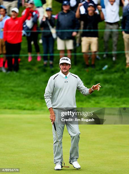 Bubba Watson waves to the gallery after winning the final round of the Travelers Championship in a playoff against Paul Casey of England at TPC River...