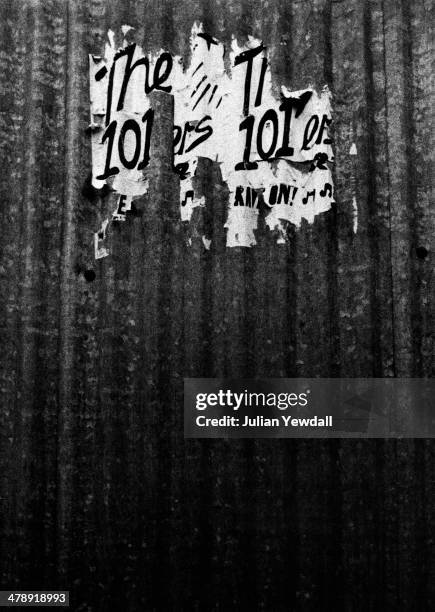 Remnants of a 1975 poster for English pub rock group The 101ers photographed in Chippenham Road, London W9, 1977. The 101ers' singer and rhythm...