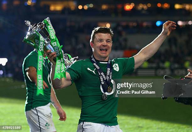 Brian O'Driscoll of Ireland celebrate with the trophy after winning the six nations championship with a 22-20 victory over France during the RBS Six...