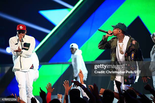 Recording artists Chris Brown and Tyga perform onstage during the 2015 BET Awards at the Microsoft Theater on June 28, 2015 in Los Angeles,...