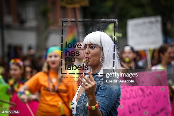 Participants holding flags march in the Gay Pride Parade on June 28, 2015 in New York City. The 22nd parade is held two days after the U.S. Supreme...