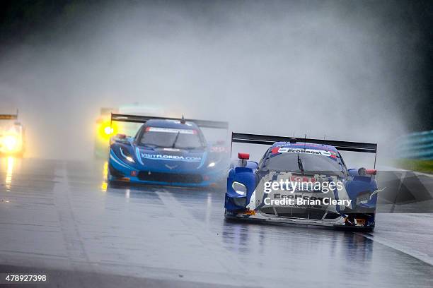 The Ford Riley of Scott Pruett and Joey Hand races in the rain during the Sahlen's Six Hours of the Glen at Watkins Glen International on June 28,...