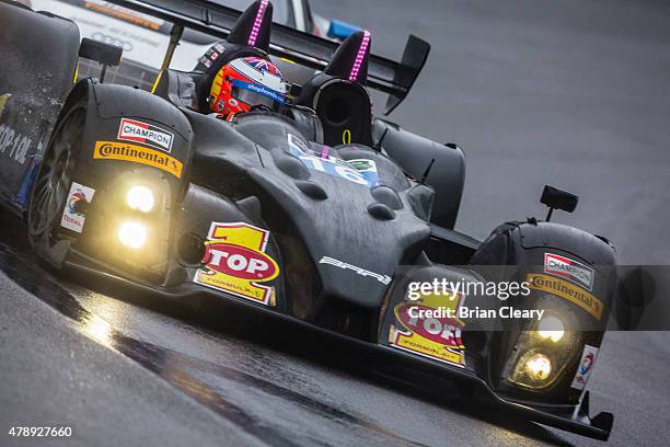 The ORECA FLM09 of Martin Plowman, Daniel Burkett, and Matt McMurry races in the rain during the Sahlen's Six Hours of the Glen at Watkins Glen...