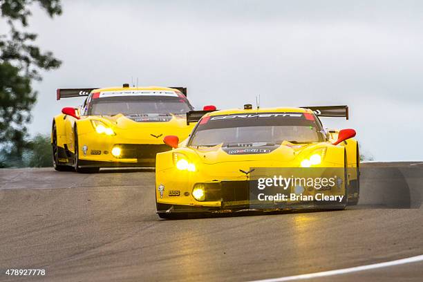 The Corvette of Oliver Gavin and Tommy Milner leads its team car of Jan Magnussen and Antonio Garcia during the Sahlen's Six Hours of the Glen at...