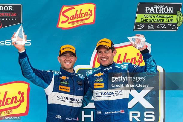 Michael Valiante, left, and Richard Westbrook celebrate after winning the Sahlen's Six Hours of the Glen at Watkins Glen International on June 28,...