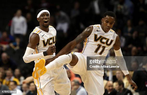 Briante Weber and Rob Brandenberg of the Virginia Commonwealth Rams celebrate after a basket by Brandenberg to end the first half against the George...