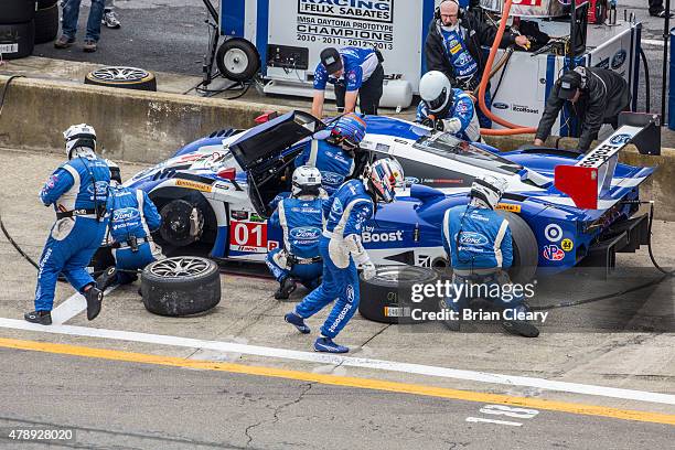 The Ford Riley of Scott Pruett and Joey Hand makes apit stop during the Sahlen's Six Hours of the Glen at Watkins Glen International on June 28, 2015...