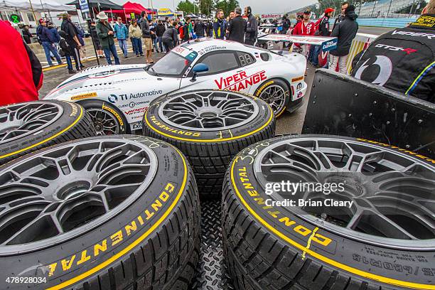 Rain tires are stacked by the Dodge Viper of Ben Keating and Jeroen Bleekemolen before the Sahlen's Six Hours of the Glen at Watkins Glen...