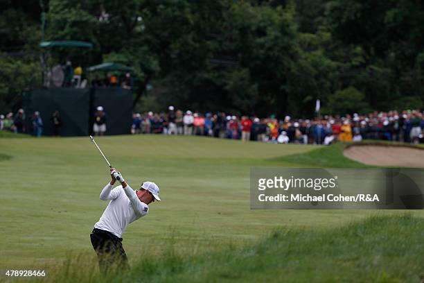 Graham Delaet of Canada hits his second shot on the ninth hole during the final round of the Travelers Championship held at TPC River Highlands on...