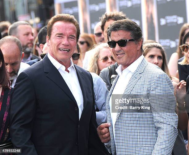 Actors Arnold Schwarzenegger and Sylvester Stallone arrive at the Los Angeles premiere of 'Terminator Genisys' at the Dolby Theatre on June 28, 2015...