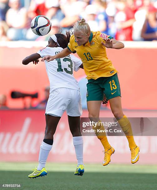 Tameka Butt of Australia battles for a header against Ngozi Okobi of Nigeria during the FIFA Women's World Cup Canada 2015 match between Australia...