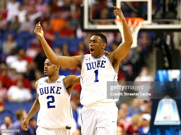 Teammates Quinn Cook and Jabari Parker of the Duke Blue Devils run down the court against the North Carolina State Wolfpack during the semifinals of...