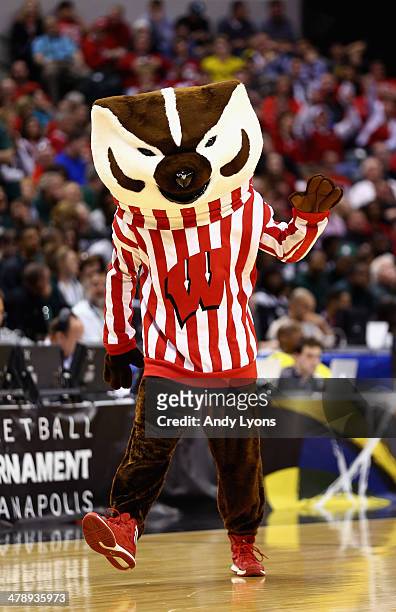 The Wisconsin Badgers mascot, Bucky Badger, performs during the second half of the Big Ten Basketball Tournament Semifinal game against the Michigan...