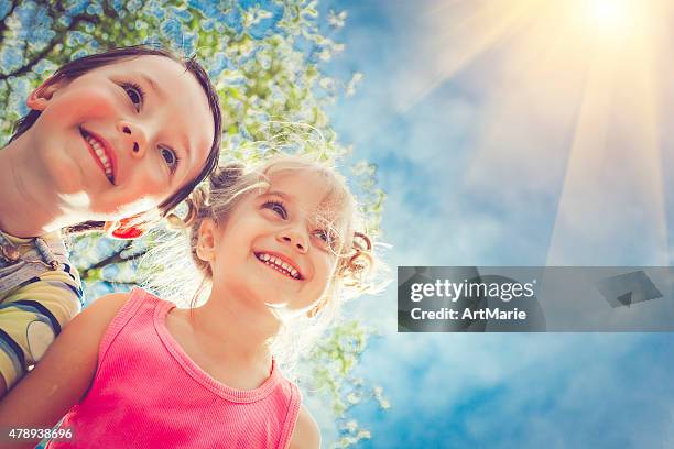 happy children in summer - face happy sun stockfoto's en -beelden