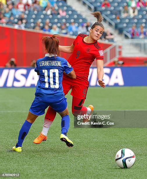 Lena Lotzen of Germany collides with Sunisa Srangthaisong of Thailand during the FIFA Women's World Cup Canada 2015 match between Thailand and...