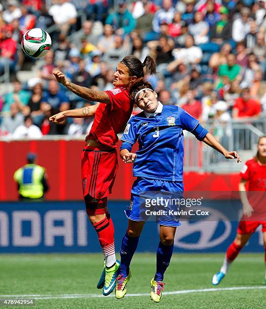 Natthakarn Chinwong of Thailand challenges Dzsenifer Marozsan of Germany during the FIFA Women's World Cup Canada 2015 match between Thailand and...