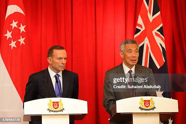 Singapore Prime Minister Lee Hsien Loong speaks during the joint press conference as Australian Prime Minister Tony Abbott looks on at the Istana on...