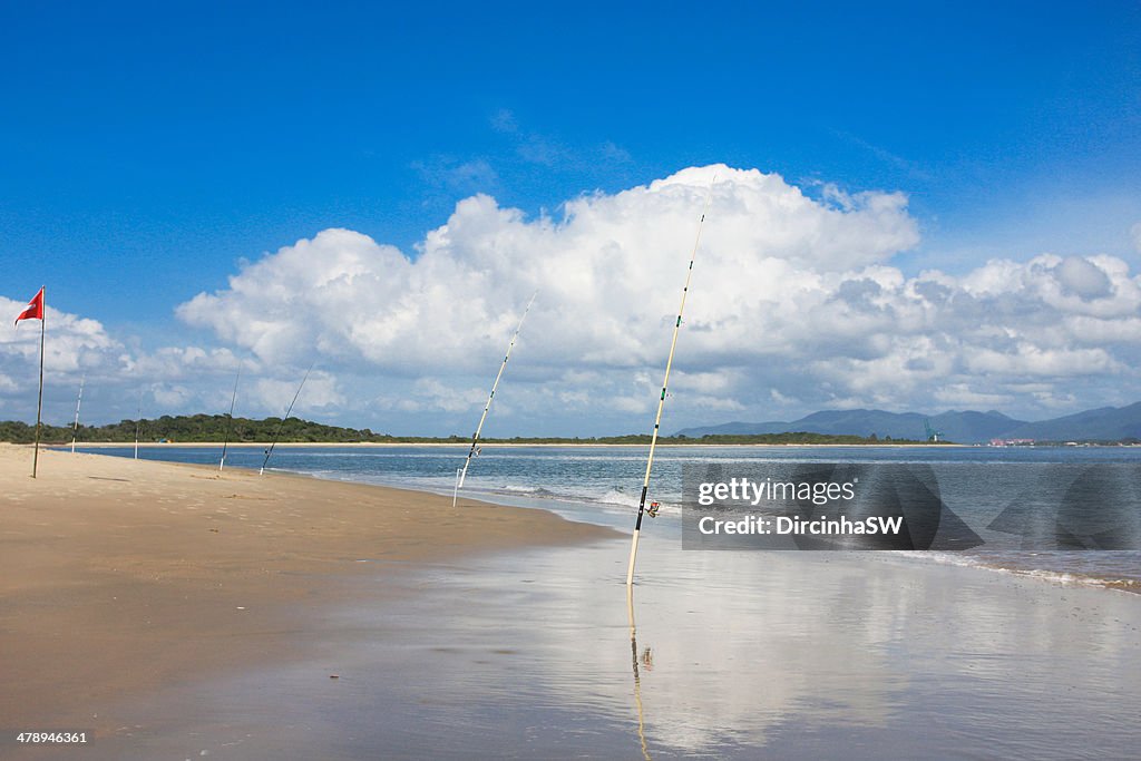 Fishing rods by the beach.