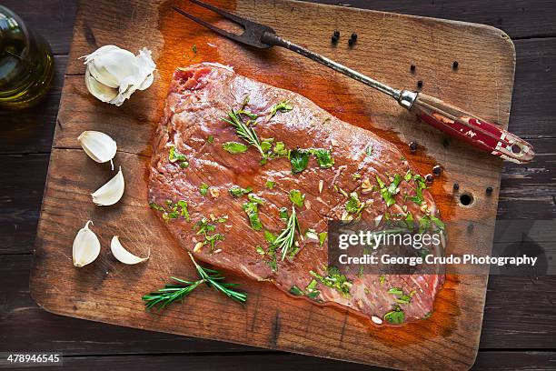 uncooked marinated flank steak - flank steak stock pictures, royalty-free photos & images