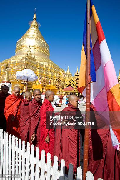Buddhist monks inside the Shwezigon pagoda during a festival in Bagan, Burma also called Myanmar.