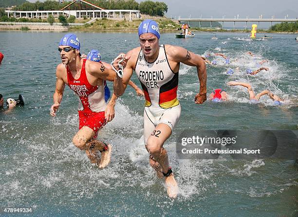 Sven Riederer of Switzerland and Jan Frodeno of Germany in action during the swimming section of the Men's Triathlon Final at the Triathlon Venue on...