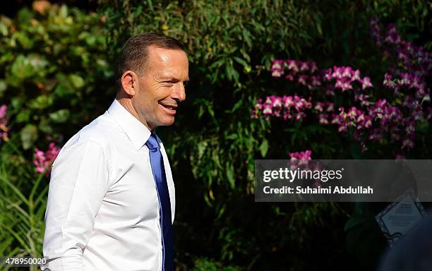 Australian Prime Minister Tony Abbott tours the orchid garden at the National Orchid Garden on June 29, 2015 in Singapore. Australian Prime Minister...