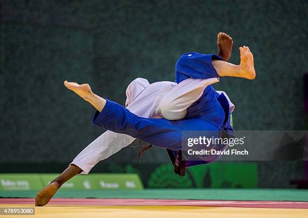 Madeleine Malonga of France throws Luise Malzahn of Germany for ippon to finish their women's team final 4 wins to one during the 2015 Baku European...