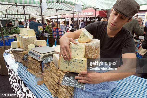 English Blue Stilton cheese on stall at Broadway Market, London, UK