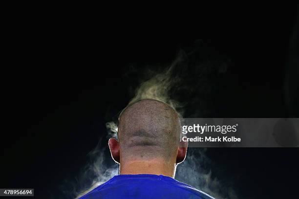 Steam rises off David Klemmer of the Bulldogs as he watches on from the bench during the round 16 NRL match between the Canterbury Bulldogs and the...