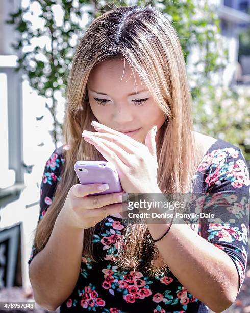Checking social media in bright sunshine