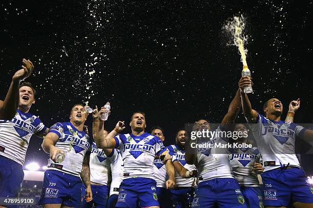 The Bulldogs team sing their team song in front of the crowd on the hill as they celebrate victory during the round 16 NRL match between the...