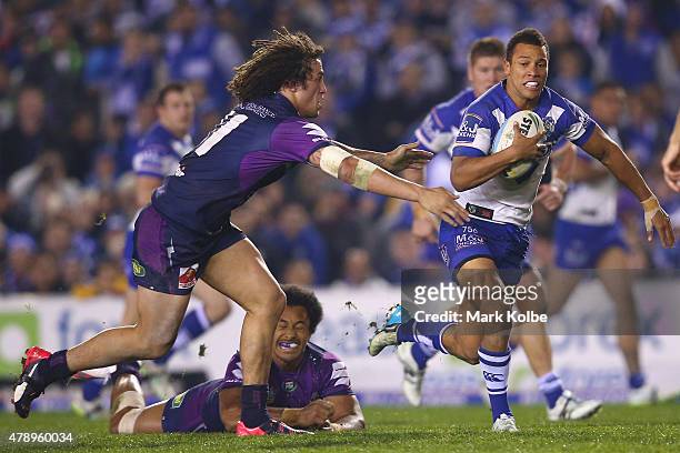 Moses Mbye of the Bulldogs makes a break during the round 16 NRL match between the Canterbury Bulldogs and the Melbourne Storm at Belmore Sports...