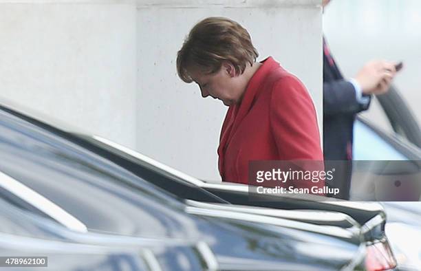 German Chancellor Angela Merkel arrives at the Chancellery for an extraordinary meeting with leaders of Germany's main political parties the day...