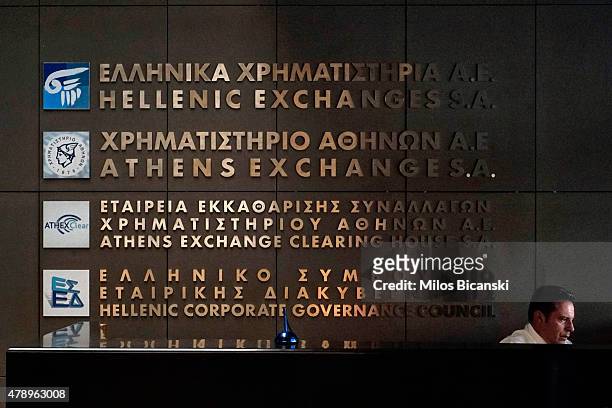 An employee sits in the Athens stock exchange on June 29, 2015 in Athens, Greece. Greece closed its banks and imposed capital controls on Sunday to...