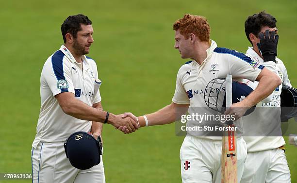 Yorkshire batsmen Tim Bresnan and Jonny Bairstow congratulate each other after coming off for lunch with their partnership unbeaten on 250 runs...