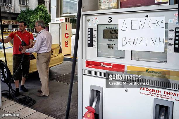 Notice at a petrol station reads "NO Fuel" on June 29, 2015 in Athens, Greece. Greece closed its banks and imposed capital controls on Sunday to...