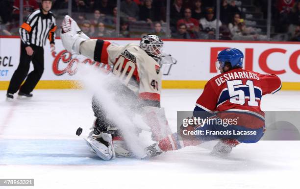 David Desharnais of the Montreal Canadiens takes a shot in the first period against Robin Lehner of the Ottawa Senators during the NHL game on March...