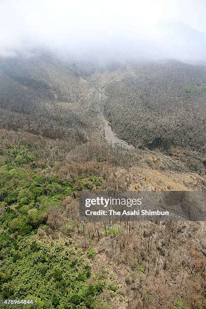 In this aerial image, a site of pyroclastic flow is seen while the summit of Mount Shindake of Kuchinoerabu Island is covered with clouds on June 29,...