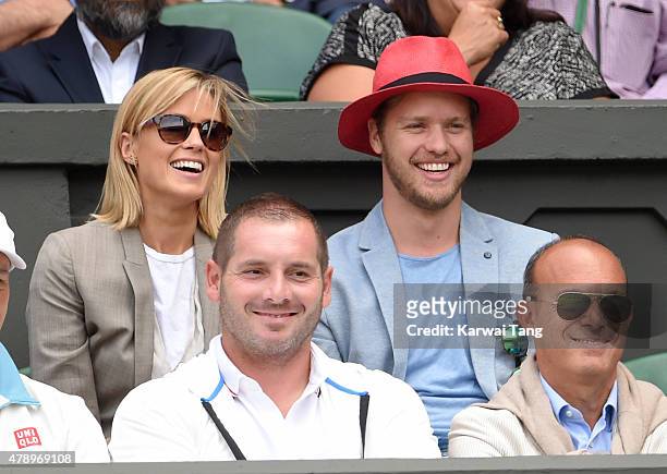 Isabella Calthorpe and Sam Branson attend the Philipp Kohlschreiber v Novak Djokovic match on day one of the Wimbledon Tennis Championships on June...