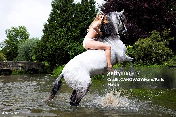 Pentathlon champion Elodie Clouvel is photographed for Paris Match with Unico, a horse trained by Mario Luraschio. June 18, 2015 in Bourg-la-Reine,...