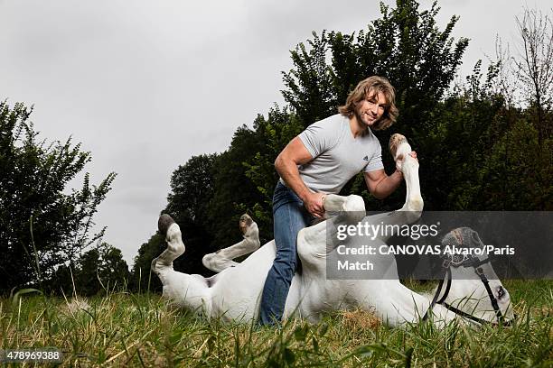 Rugby player Dimitri Szarzewski is photographed for Paris Match with Nador, a horse trained by Mario Luraschio. June 11, 2015 in Bourg-la-Reine,...