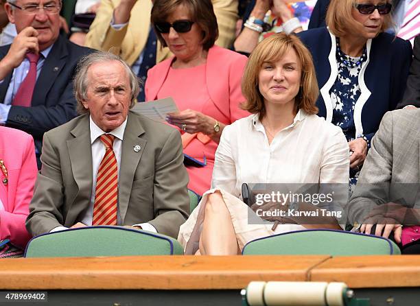 Jackie Stewart and Fiona Bruce attend the Philipp Kohlschreiber v Novak Djokovic match on day one of the Wimbledon Tennis Championships on June 29,...