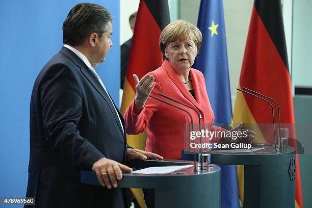 German Chancellor Angela Merkel and Vice Chancellor and Economy and Energy Minister Sigmar Gabriel speak to the media following an extraordinary...