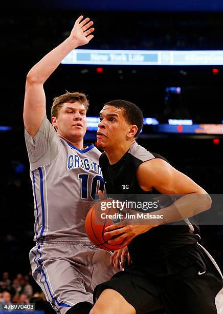 Tyler Harris of the Providence Friars drives against Grant Gibbs of the Creighton Bluejays in the first half during the Championship game of the 2014...