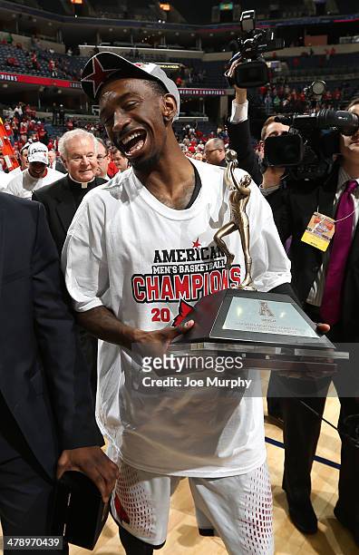 Russ Smith of the Louisville Cardinals celebrates with his tournament MVP trophy after defeating the Connecticut Huskies during the Championship of...