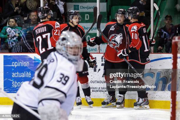 Jason Fuchs of the Rouyn-Noranda Huskies celebrates his third period goal with Jean-Sebastien Dea, Ryan Penny and Francis Perron as Anthony Brodeur...