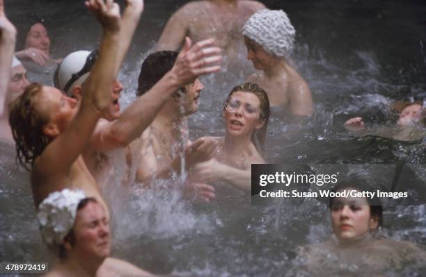 Italian film actor Marcello Mastroianni and British actress Billie Whitelaw in a swimming pool, with other naked cast members, in a scene from the...