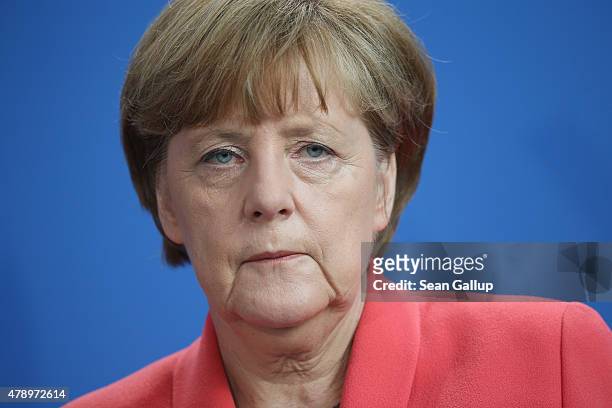 German Chancellor Angela Merkel speaks to the media following an extraordinary meeting with leaders of Germany's main political parties at the...